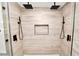 Modern tile shower with dual shower heads and a built-in niche at 6604 Stafford Terrace Ave, Plant City, FL 33565