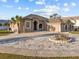 Charming home featuring a circular driveway, well-manicured landscaping, and a welcoming entryway at 821 Greenview Dr, Apollo Beach, FL 33572