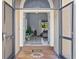 View from the front doorway into a tiled foyer and open-concept living space of home at 821 Greenview Dr, Apollo Beach, FL 33572
