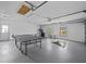 Spacious garage featuring abundant natural light, recreational equipment, and ample room for parking and activities at 821 Greenview Dr, Apollo Beach, FL 33572