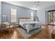 Spacious main bedroom with hardwood floors and a serene, light-filled atmosphere at 821 Greenview Dr, Apollo Beach, FL 33572