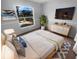 Bright bedroom featuring a cozy bed, stylish furnishings, and natural light at 8103 Rhanbuoy Rd, Spring Hill, FL 34606