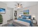 Comfortable bedroom featuring a ceiling fan, closet, and soothing decor at 1906 E Ida St, Tampa, FL 33610