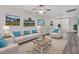 Bright living room with hardwood floors, a ceiling fan, and neutral colors provides an inviting atmosphere at 1906 E Ida St, Tampa, FL 33610