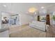Open-concept living room showcasing hardwood floors and seamless transition to the kitchen and dining areas at 7746 Westmoreland Dr, Sarasota, FL 34243