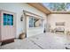 Exterior view of a patio area with a door, window, and concrete flooring at 8700 Powderhorn Row, Hudson, FL 34667