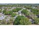 Aerial view of the property in a quiet neighborhood with lush, mature landscaping at 1333 Mohrlake Dr, Brandon, FL 33511