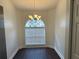 Cozy dining area featuring an arched window and a stylish chandelier at 1333 Mohrlake Dr, Brandon, FL 33511