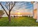 Expansive backyard featuring mature landscaping and outdoor seating area with waterfront views at 1903 Gulfview Dr, Holiday, FL 34691