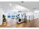 Bright living room features hardwood floors and floor-to-ceiling windows with ocean views at 1903 Gulfview Dr, Holiday, FL 34691
