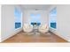 Sitting area with water views, wood floors, and neutral furniture at 1903 Gulfview Dr, Holiday, FL 34691