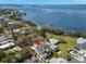 Aerial view of the waterfront property showcasing its location and proximity to the bay at 606 Indiana Ave, Crystal Beach, FL 34681