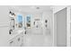Bright, spacious bathroom with double vanity, soaking tub, and modern fixtures at 606 Indiana Ave, Crystal Beach, FL 34681