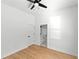 Bright bedroom features hardwood floors and ensuite bathroom at 606 Indiana Ave, Crystal Beach, FL 34681