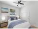 Cozy bedroom with plush bedding, a large window, and ample natural light creating a comfortable atmosphere at 606 Indiana Ave, Crystal Beach, FL 34681