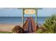 View of the Wesley S. Henry Community Pier with a view of the blue ocean at 606 Indiana Ave, Crystal Beach, FL 34681