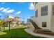 Beautiful house with a spacious yard, stairs and deck, perfect for outdoor entertaining at 606 Indiana Ave, Crystal Beach, FL 34681