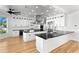Spacious kitchen with stainless steel appliances, island, and ample countertop space at 606 Indiana Ave, Crystal Beach, FL 34681