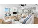 Bright living room with access to an outdoor balcony, fireplace and an open connection to the kitchen at 606 Indiana Ave, Crystal Beach, FL 34681