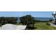 Breathtaking view of the bay from the property showcasing lush greenery and tranquil waterfront living at 606 Indiana Ave, Crystal Beach, FL 34681