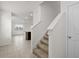 Carpeted staircase with white railing leading to the upper level of the home at 10523 Penny Gale Loop, San Antonio, FL 33576