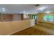 Upstairs loft area with carpet and chandelier lighting at 298 Gulfport Ln, Spring Hill, FL 34608