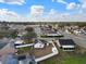 An aerial of well-spaced homes and tree lined streets create a welcoming community atmosphere on a partly cloudy day at 4604 Hunts Ave, Plant City, FL 33566