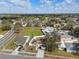 Elevated view of a home with solar panels, a fenced yard, and surrounding neighborhood at 4604 Hunts Ave, Plant City, FL 33566