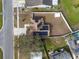 Bird's-eye view of the house with a fenced yard and solar panels on the roof at 4604 Hunts Ave, Plant City, FL 33566