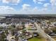 Aerial neighborhood shot with mature trees, roadways, and cozy homes on a partly cloudy day at 4604 Hunts Ave, Plant City, FL 33566