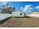 Spacious backyard with minimal landscaping and a white privacy fence at 4604 Hunts Ave, Plant City, FL 33566