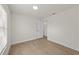 Bright bedroom with vinyl flooring and a view to an open door at 4604 Hunts Ave, Plant City, FL 33566