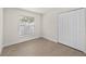 A bedroom with white walls, wood floor, and a window with blinds at 4604 Hunts Ave, Plant City, FL 33566