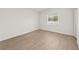 Well lit bedroom with vinyl flooring, window and closet at 4604 Hunts Ave, Plant City, FL 33566