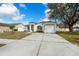 View of the property showcasing the home's front yard and curb appeal at 4604 Hunts Ave, Plant City, FL 33566