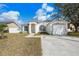 Attractive front exterior showcasing the two-car garage at 4604 Hunts Ave, Plant City, FL 33566