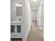 Hallway with a bathroom vanity and doors leading to other rooms of the residence at 4604 Hunts Ave, Plant City, FL 33566