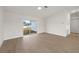 Living room showcasing the sliding glass doors and wood flooring at 4604 Hunts Ave, Plant City, FL 33566