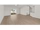 Bright living room with sliding glass doors and wood-look flooring at 4604 Hunts Ave, Plant City, FL 33566