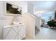 Elegant home entryway with modern decor, a staircase, and neutral tones at 6744 Back Forty Loop, Zephyrhills, FL 33541