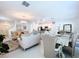 Bright and airy living room featuring elegant furnishings and a modern chandelier at 6744 Back Forty Loop, Zephyrhills, FL 33541