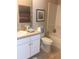 Well-lit bathroom with white cabinets, framed art, and coordinated colors at 7037 Towering Spruce Dr, Riverview, FL 33578