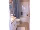 Bathroom with toilet, tub and shower, and vanity with sink at 7037 Towering Spruce Dr, Riverview, FL 33578