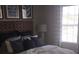 Bedroom featuring cozy bedding and bright natural light from a window at 7037 Towering Spruce Dr, Riverview, FL 33578