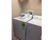 Convenient laundry room with modern washer and dryer, ready for easy chore days at 7037 Towering Spruce Dr, Riverview, FL 33578