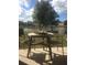 Outdoor patio featuring a table and chairs, perfect for enjoying the serene water view at 7037 Towering Spruce Dr, Riverview, FL 33578