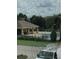 Screened pool view showcases a relaxing outdoor area with lush landscaping at 7037 Towering Spruce Dr, Riverview, FL 33578