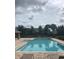 Inviting community pool featuring a splash pad area, perfect for hot summer days at 7037 Towering Spruce Dr, Riverview, FL 33578