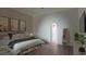 Comfortable bedroom with hardwood floors, soft lighting, and ample closet space at 15945 Viscount Cir, Port Charlotte, FL 33981