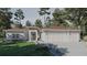 Charming single story home with a three car garage and a manicured lawn, nestled among mature trees at 15945 Viscount Cir, Port Charlotte, FL 33981